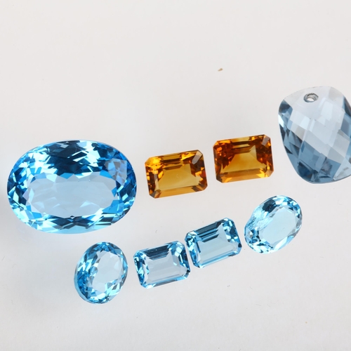 1529 - A group of unmounted gemstones, including blue topaz and citrine, largest 19.9 x 14.9 x 9.4mm