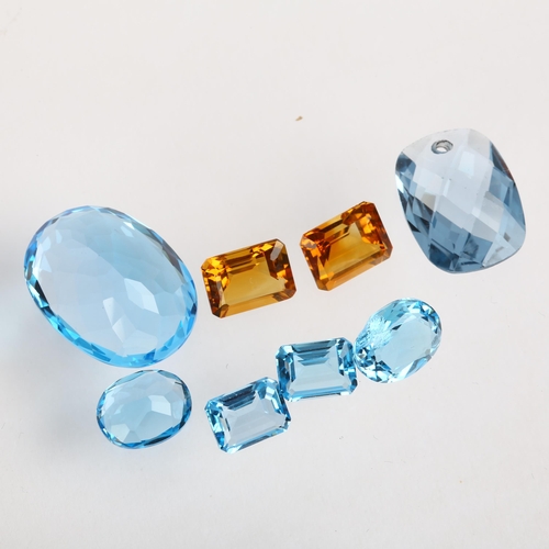 1529 - A group of unmounted gemstones, including blue topaz and citrine, largest 19.9 x 14.9 x 9.4mm