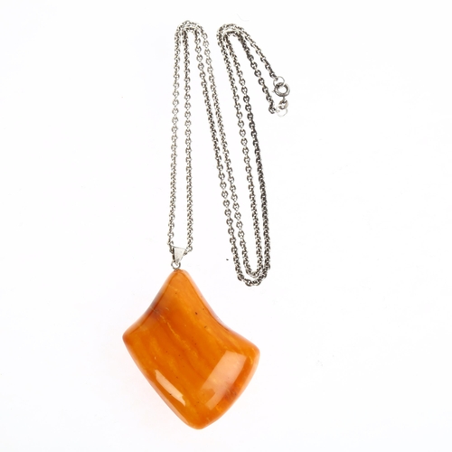 1534 - TURM GULD & SOLV - a Danish sterling silver Baltic amber pendant necklace, on sterling cable link ch... 