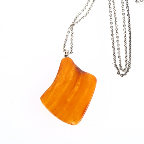 1534 - TURM GULD & SOLV - a Danish sterling silver Baltic amber pendant necklace, on sterling cable link ch... 