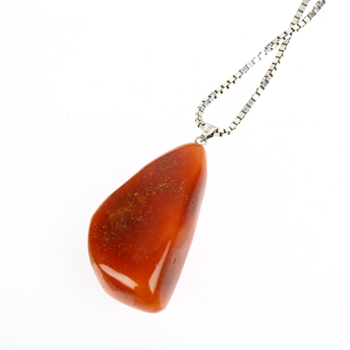 1535 - TURM GULD & SOLV - a Danish sterling silver Baltic amber pendant necklace, on sterling box link chai... 