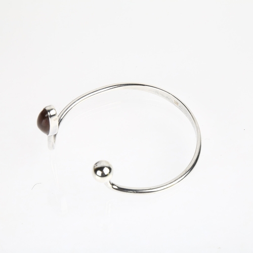 1537 - NIELS ERIK FROM - a Danish modernist sterling silver amber torque bangle, setting height 41.7mm, int... 