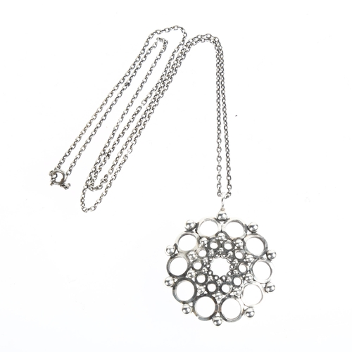 1538 - KALEVALA KORU - a Finnish modernist sterling silver openwork flowerhead pendant necklace, circa 1979... 