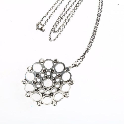 1538 - KALEVALA KORU - a Finnish modernist sterling silver openwork flowerhead pendant necklace, circa 1979... 