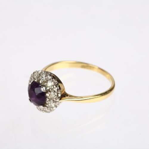 1566 - A mid-20th century 18ct gold amethyst and diamond circular cluster ring, platinum-topped, claw set w... 