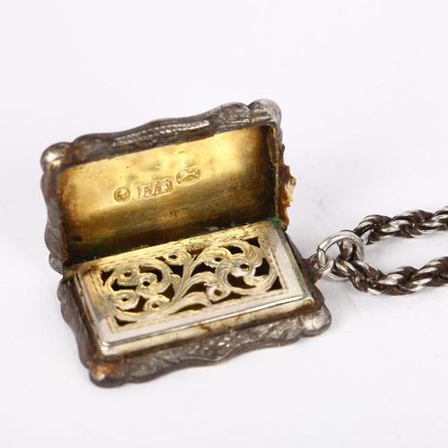 1616 - A Victorian silver vinaigrette, James Fenton, Birmingham 1855, shaped rectangular form, with engine ... 