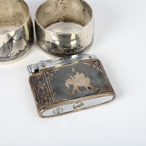 1622 - 2 Iraqi silver and niello napkin rings, largest 4.5cm, and a Siam sterling and niello Ronson Adonis ... 