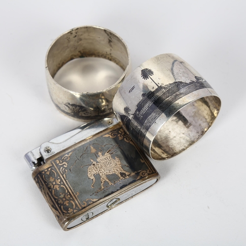 1622 - 2 Iraqi silver and niello napkin rings, largest 4.5cm, and a Siam sterling and niello Ronson Adonis ... 