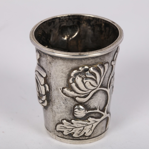 1627 - A Chinese export silver 'chrysanthemum' drinking tot, retailed by Wang Hing, relief embossed decorat... 