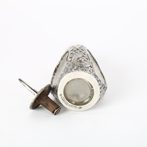 1637 - A Chinese sterling silver-mounted glass dimple scent flask, Hong Kong, maker KH, pierced dragon deco... 