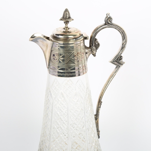 1644 - An early 20th century silver plate mounted glass Claret jug, acanthus finial with bright-cut engrave... 