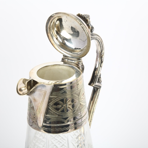 1644 - An early 20th century silver plate mounted glass Claret jug, acanthus finial with bright-cut engrave... 