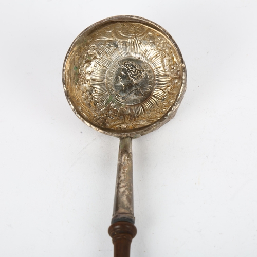 1665 - A Georgian silver toddy ladle, with inset 1711 coin base and turned wood handle, length 30cm