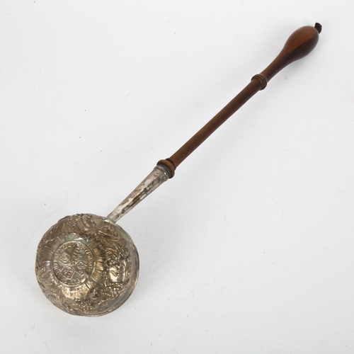 1665 - A Georgian silver toddy ladle, with inset 1711 coin base and turned wood handle, length 30cm