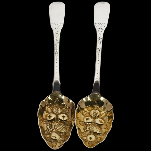 1667 - A pair of George III silver Fiddle pattern berry spoons, Solomon Hougham, London 1816, 22cm, 3.8oz t... 