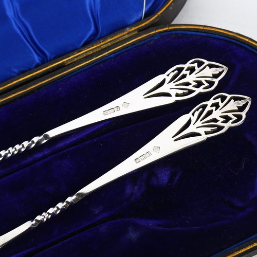 1669 - A pair of George V silver strawberry spoons, Martin Hall & Co, Sheffield 1910, pierced foliate decor... 