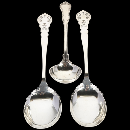 1670 - A pair of Edwardian silver decorative serving spoons, Allen & Darwin, Sheffield 1908, and a silver s... 