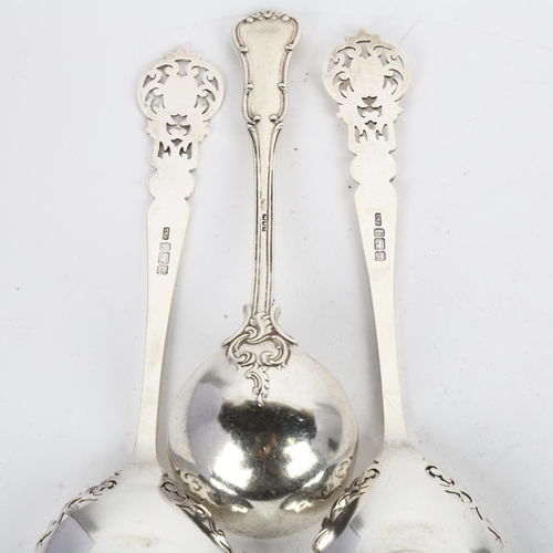 1670 - A pair of Edwardian silver decorative serving spoons, Allen & Darwin, Sheffield 1908, and a silver s... 