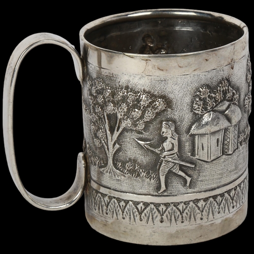 1696 - An Indian silver christening mug, relief embossed decoration depicting figures and elephant in villa... 