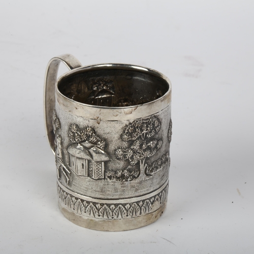 1696 - An Indian silver christening mug, relief embossed decoration depicting figures and elephant in villa... 