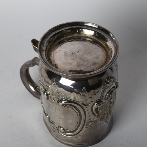 1702 - A George I silver pint mug, indistinct maker, London 1721, cylindrical form with folded foot, gilt i... 