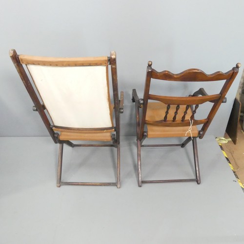 2129 - Two similar campaign style folding chairs.