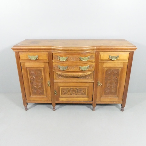 2134 - A mahogany Art Nouveau style sideboard, with four drawers, three cupboards and carved foliate decora... 