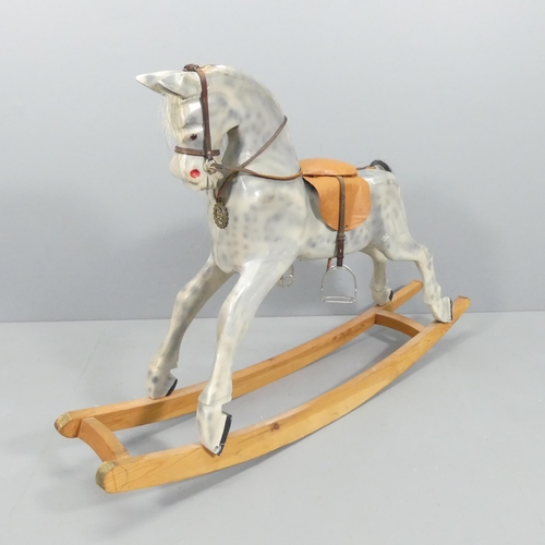 2137 - A painted wooden rocking horse, with leather tack and horsehair tail. 150x100x35cm.