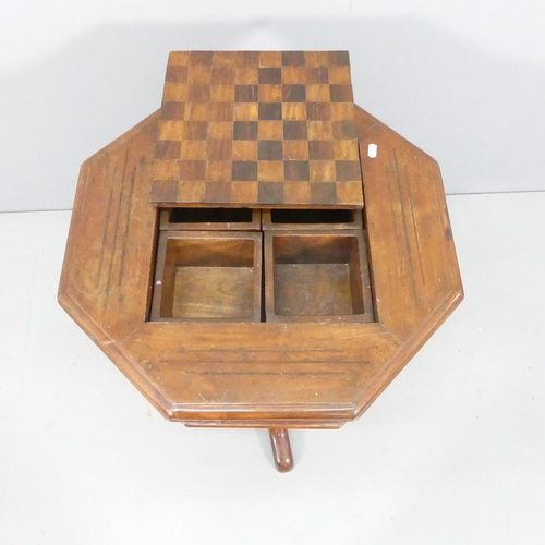 2152 - A modern mahogany octagonal games top occasional table, with lifting inset chessboard and tripod bas... 