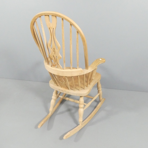 2153 - A modern pine Windsor rocking chair.