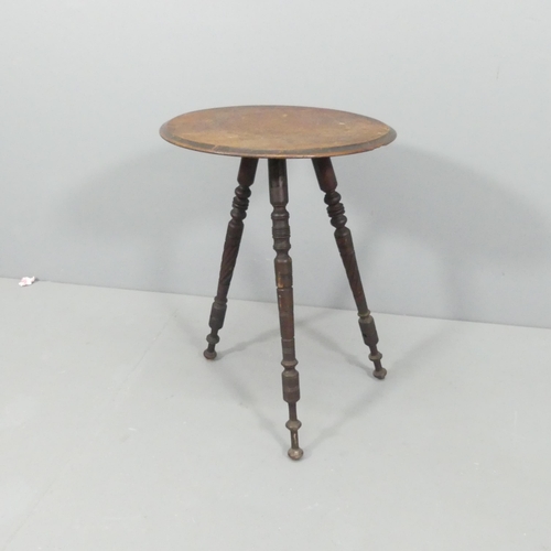 2171 - An antique mahogany circular-topped occasional table, on tripod base with carved decoration. 36x64cm... 