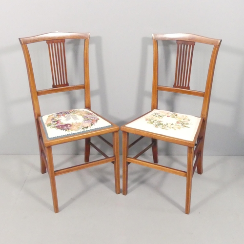 2172 - A pair of Edwardian mahogany and satinwood strung side chairs, with needlepoint upholstered seats an... 