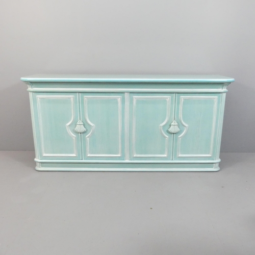 2174 - A contemporary continental style painted wooden sideboard, with four panelled doors and applied carv... 