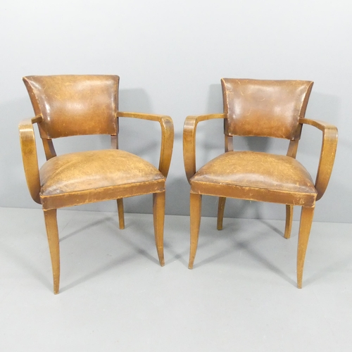 2219 - A pair of French mid-century oak and leather upholstered Bridge chairs.