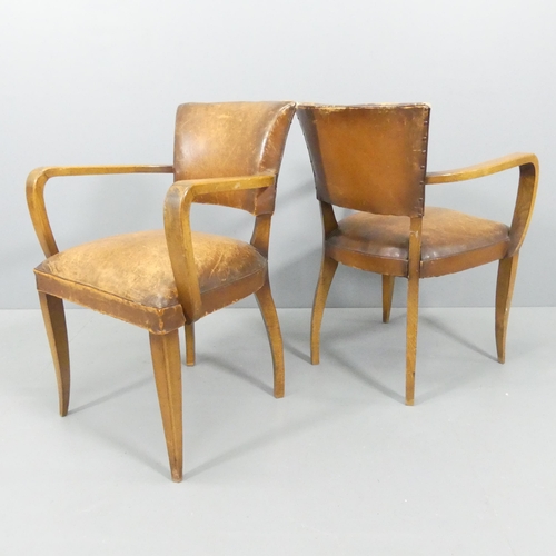 2219 - A pair of French mid-century oak and leather upholstered Bridge chairs.