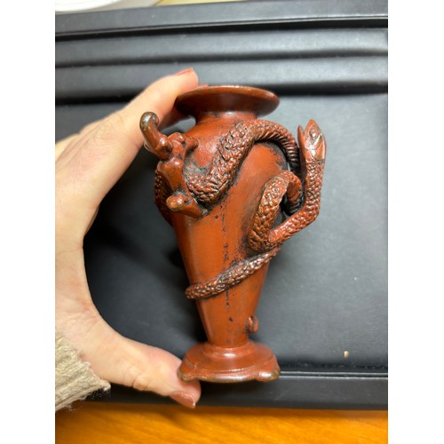 236 - A Japanese red/brown patinated bronze miniature vase, with entwined serpent body, height 11cm