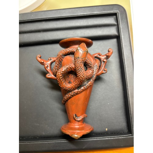 236 - A Japanese red/brown patinated bronze miniature vase, with entwined serpent body, height 11cm