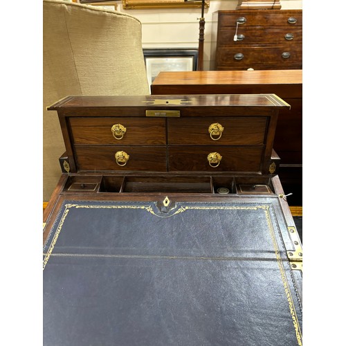 92 - An unusual 19th century brass-bound rosewood campaign travelling writing box, with rising drawer-fit... 