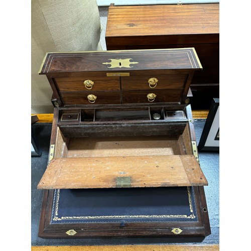 92 - An unusual 19th century brass-bound rosewood campaign travelling writing box, with rising drawer-fit... 