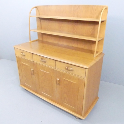 2054 - A mid-century light oak dresser, with open plate rack, and three drawers above one single and one bi... 