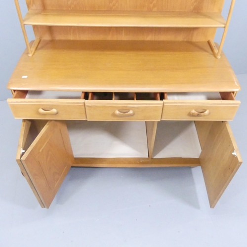 2054 - A mid-century light oak dresser, with open plate rack, and three drawers above one single and one bi... 