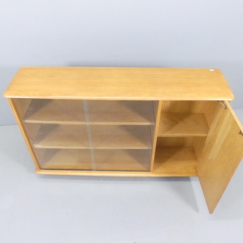 2055 - A mid-century elm bookcase / display cabinet, with one cupboard door and two sliding glass doors wit... 