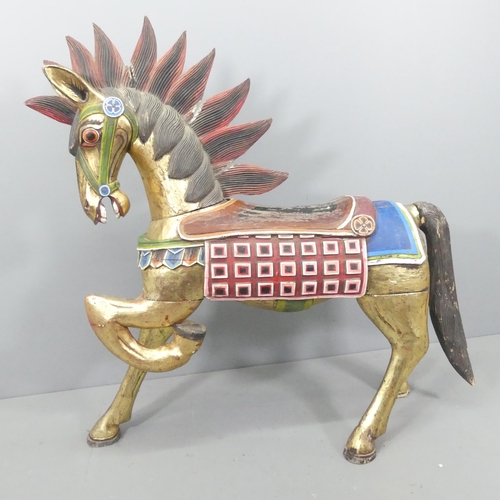 2057 - An Indonesian hand painted and gilded wooden horse. 137x132x44cm.