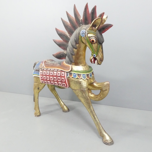 2057 - An Indonesian hand painted and gilded wooden horse. 137x132x44cm.