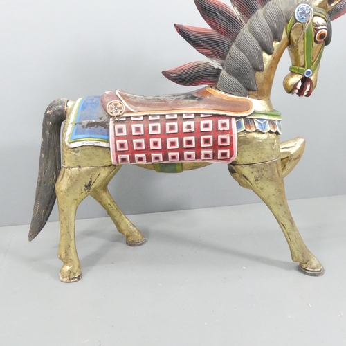 2057 - An Indonesian hand painted and gilded wooden horse. 137x132x44cm.