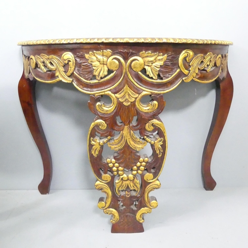 2058 - A continental style mahogany demi-lune console table with carved decoration. 101x77x39cm.