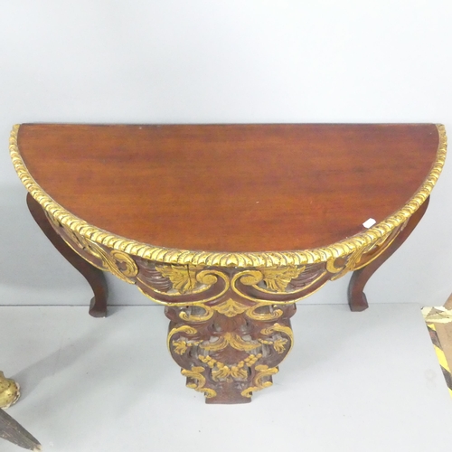 2058 - A continental style mahogany demi-lune console table with carved decoration. 101x77x39cm.