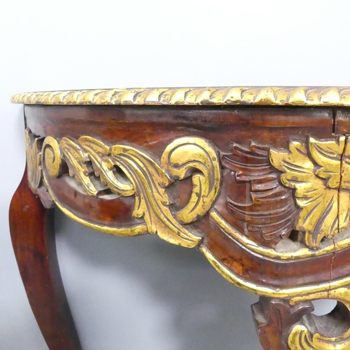 2058 - A continental style mahogany demi-lune console table with carved decoration. 101x77x39cm.