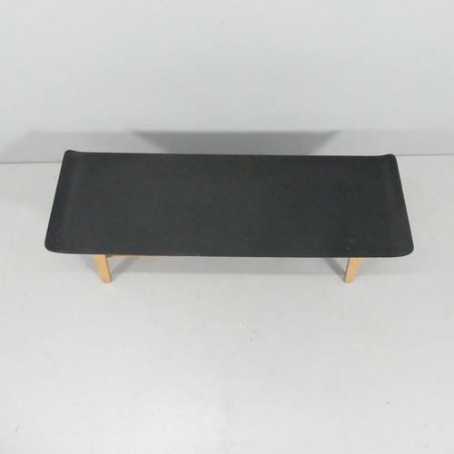 2074 - A mid-century Scandinavian design two-tier coffee table, with ebonised bent-ply top on teak base and... 