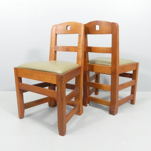 2077 - A set of four Brutalist teak dining chairs with leather upholstered seats.